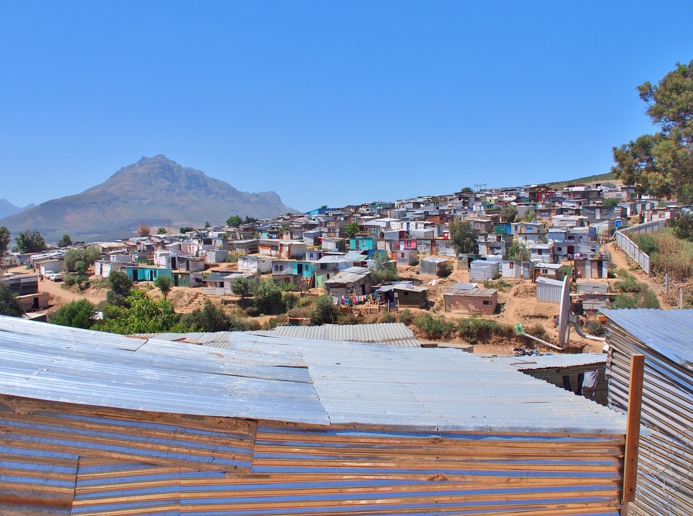 Informal,Settlement, ,Enkanini,With,Mountain,And,Blue,Sky,On